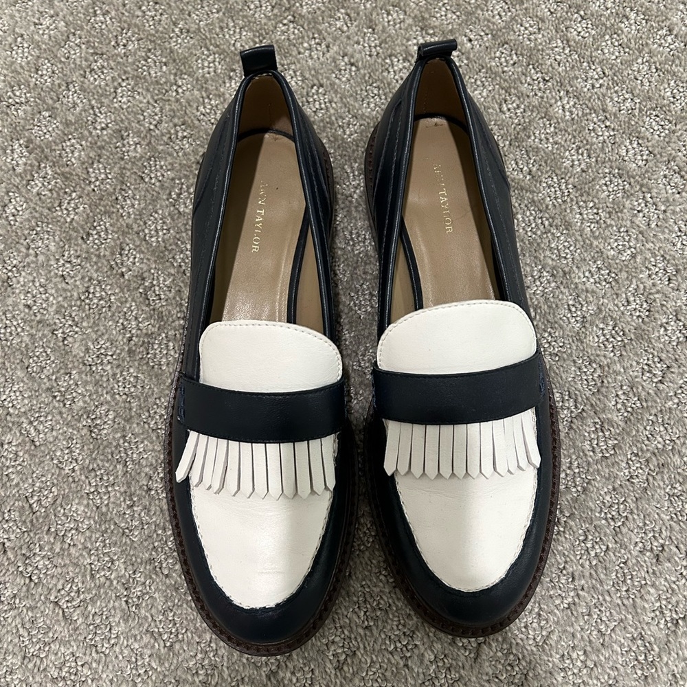 Navy and white leather loafers.